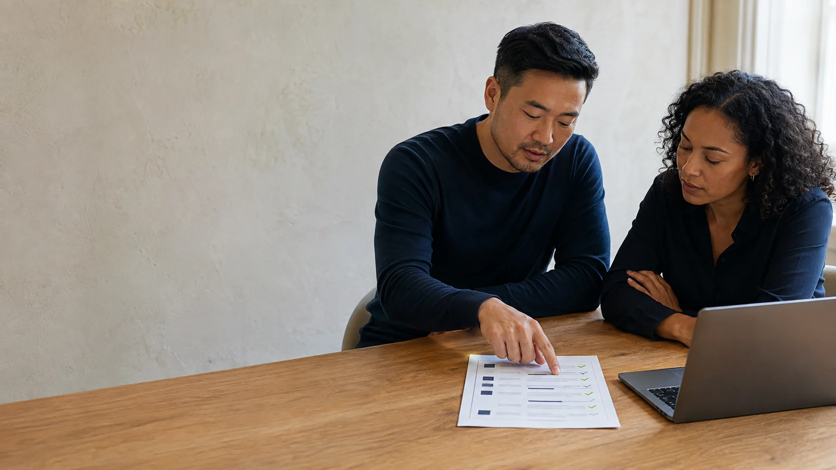 A buyer and provider reviewing one Webflow proposal and a milestone checklist